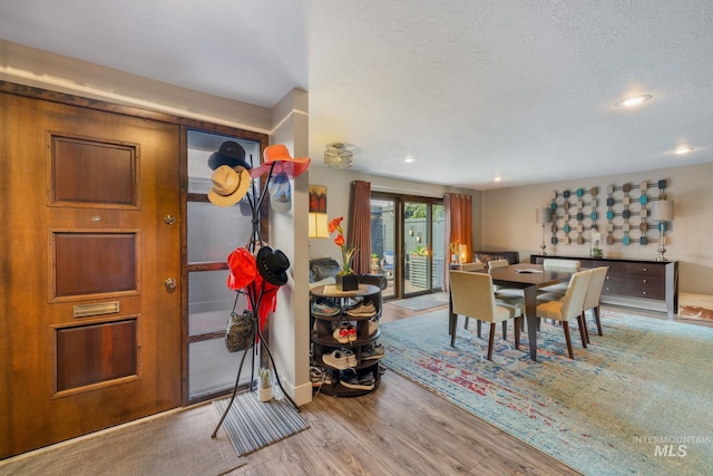 4400 W Pasadena Dr Unit 38, Boise, ID 83705 - dining space with wood finished floors, baseboards, recessed lighting, and a textured ceiling