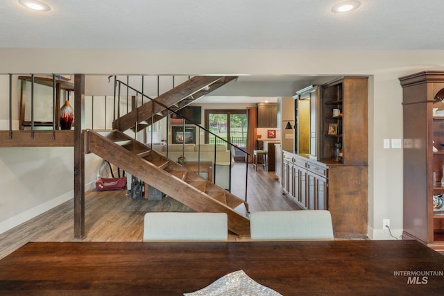 4400 W Pasadena Dr Unit 38, Boise, ID 83705 - staircase with baseboards, wood finished floors, and recessed lighting