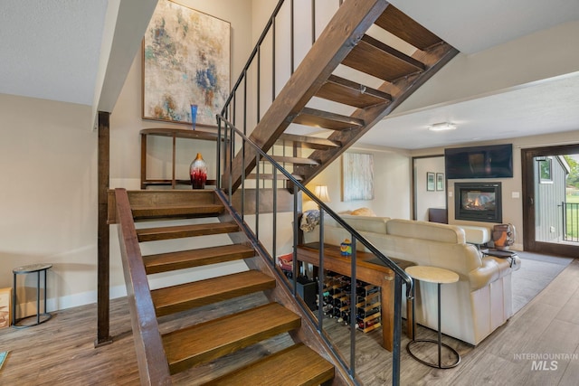 4400 W Pasadena Dr Unit 38, Boise, ID 83705 - stairs featuring wood finished floors and baseboards