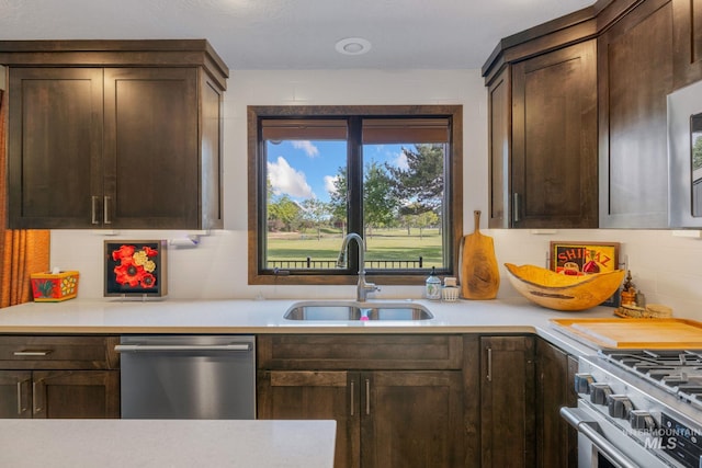4400 W Pasadena Dr Unit 38, Boise, ID 83705 - kitchen featuring stainless steel appliances, a sink, and light countertops