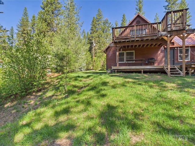 9 Pond Overlook, Idaho City, ID 83631 - rear view of house featuring a lawn and a wooden deck