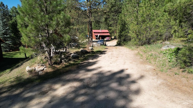 9 Pond Overlook, Idaho City, ID 83631 - view of dirt / gravel road featuring a wooded view