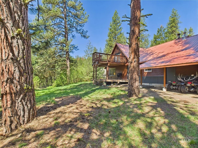 9 Pond Overlook, Idaho City, ID 83631 - view of front of house with metal roof, a deck, and a front yard