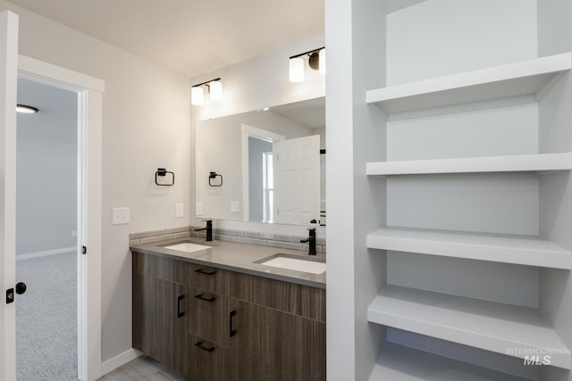 2431 W Opalite Dr, Kuna, ID 83634 - full bath featuring baseboards, double vanity, and a sink