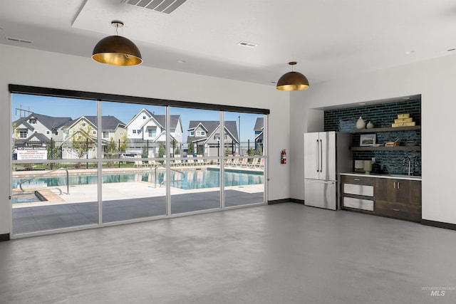 interior space featuring a residential view and a sink