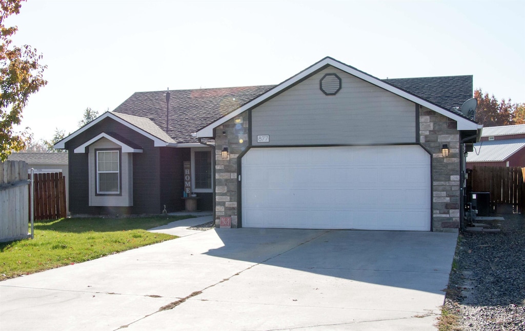 ranch-style house featuring a garage