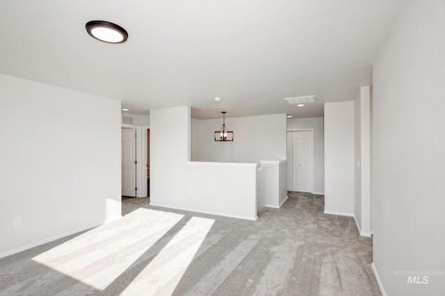 unfurnished room with light colored carpet