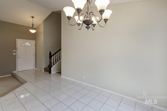 entryway featuring light tile patterned floors, baseboards, lofted ceiling, stairway, and an inviting chandelier