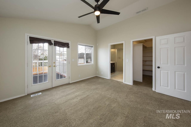 unfurnished bedroom featuring lofted ceiling, french doors, visible vents, and access to exterior