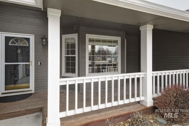 doorway to property featuring a porch