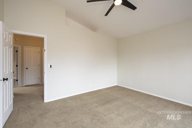 unfurnished room featuring high vaulted ceiling, carpet flooring, ceiling fan, and baseboards