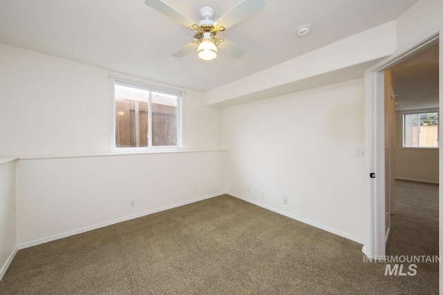 unfurnished room with carpet, ceiling fan, and baseboards