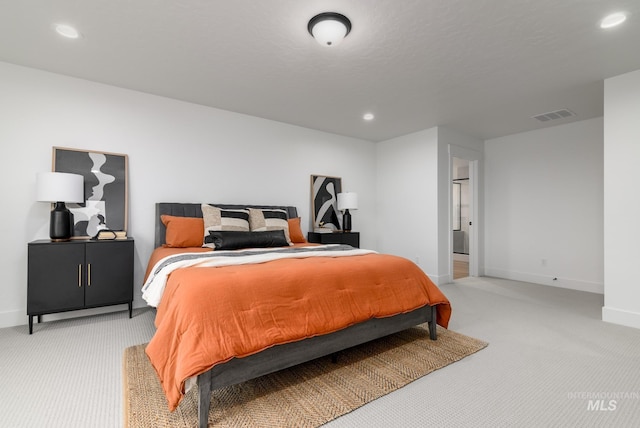 bedroom featuring recessed lighting, visible vents, light carpet, and baseboards