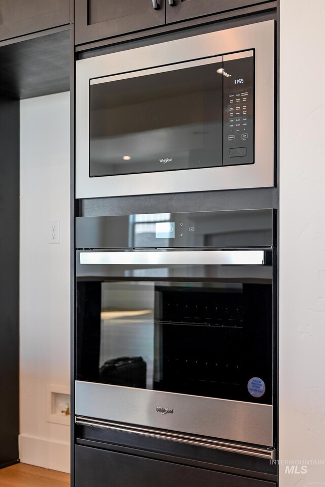 details featuring appliances with stainless steel finishes and mail area