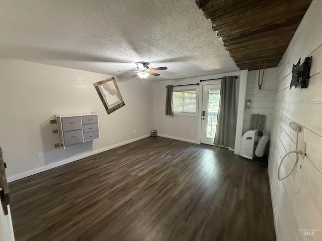 1640 N Davis Ave Unit 3, Mccall, ID 83646 - unfurnished living room featuring ceiling fan, dark wood finished floors, baseboards, and a textured ceiling