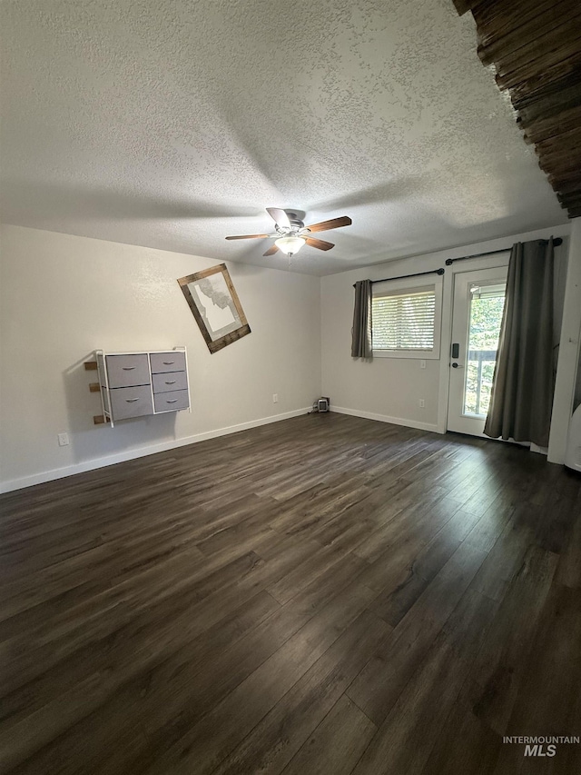 1640 N Davis Ave Unit 3, Mccall, ID 83646 - unfurnished room featuring dark wood-style floors, a ceiling fan, baseboards, and a textured ceiling