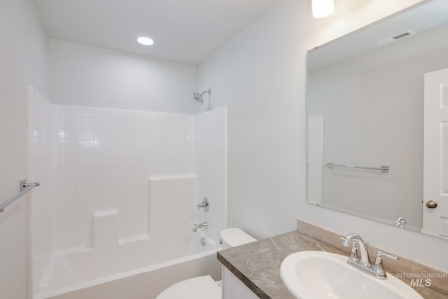 full bathroom with washtub / shower combination, toilet, and vanity