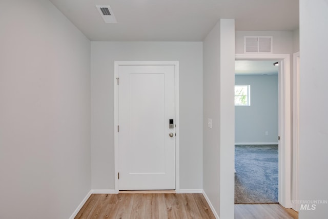 doorway to outside with light hardwood / wood-style flooring