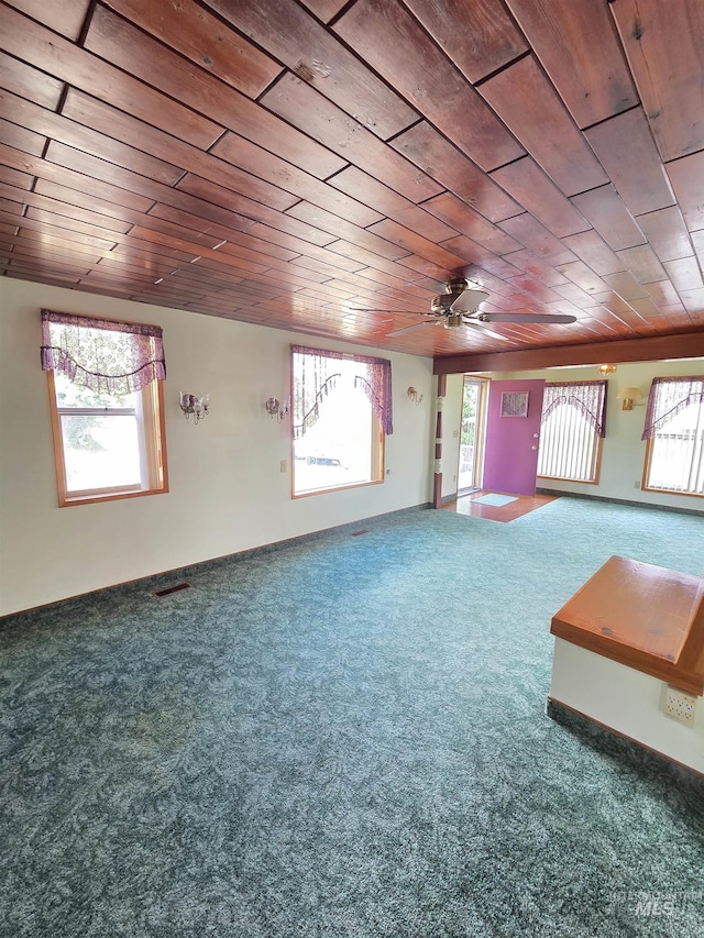 1922 9th Ave, Lewiston, ID 83501 - unfurnished living room featuring wood ceiling, carpet floors, and a ceiling fan