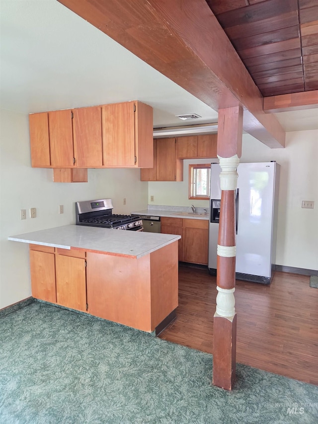 1922 9th Ave, Lewiston, ID 83501 - kitchen featuring stainless steel gas stove, fridge with ice dispenser, a peninsula, a sink, and light countertops