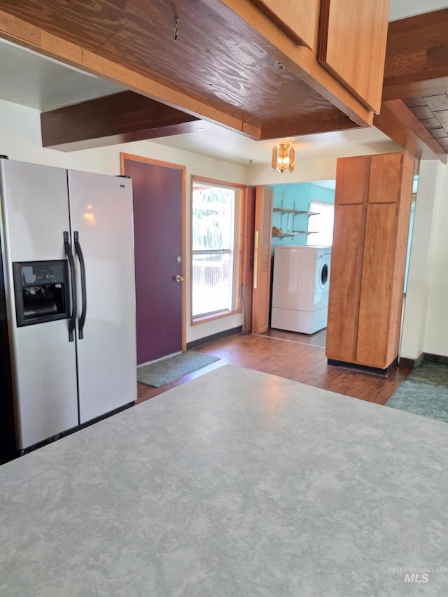 1922 9th Ave, Lewiston, ID 83501 - kitchen featuring fridge with ice dispenser, separate washer and dryer, brown cabinets, wood finished floors, and beamed ceiling