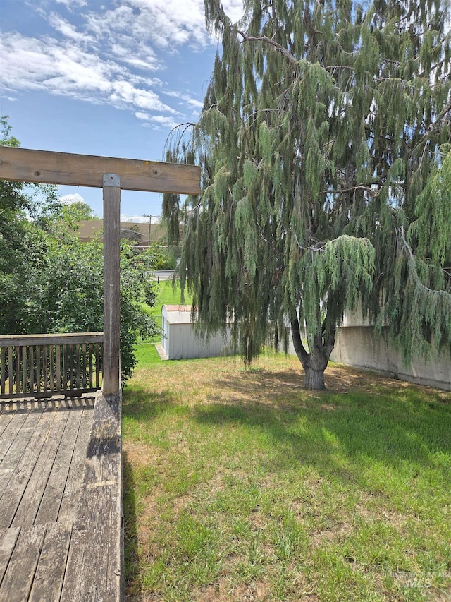 1922 9th Ave, Lewiston, ID 83501 - view of green lawn with an outdoor structure and a deck