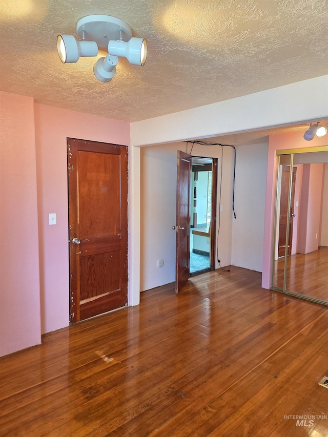 1922 9th Ave, Lewiston, ID 83501 - unfurnished room featuring a textured ceiling and wood finished floors