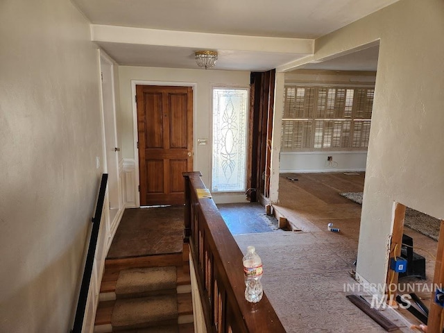 stairs featuring hardwood / wood-style floors