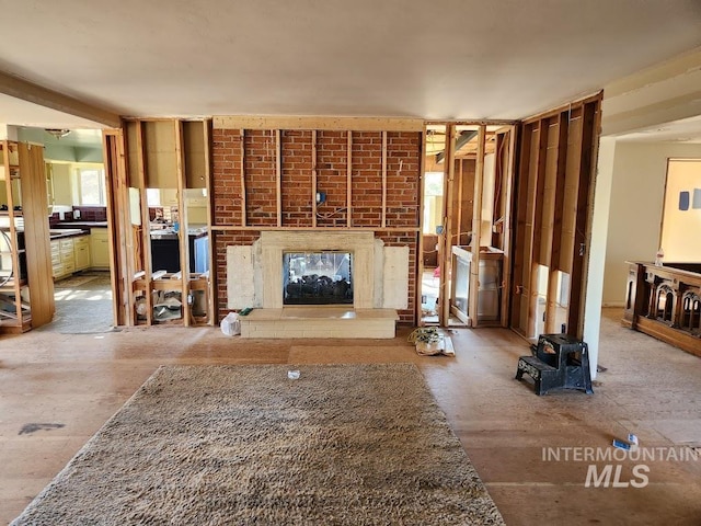 unfurnished living room with a fireplace