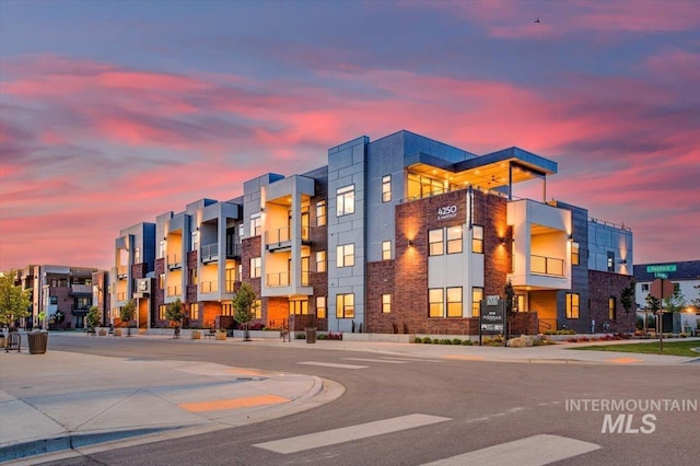 view of outdoor building at dusk