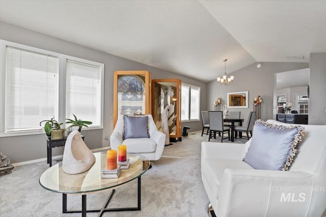 living room with a chandelier, vaulted ceiling, baseboards, and carpet floors