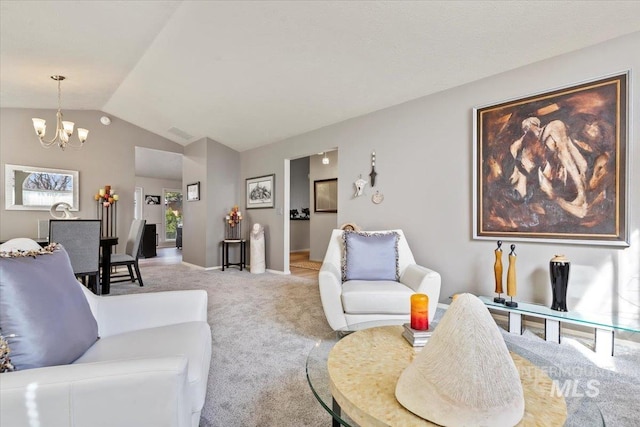 living room with light carpet, baseboards, an inviting chandelier, and vaulted ceiling