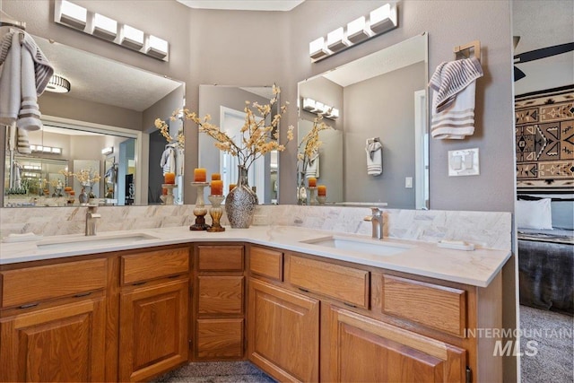 bathroom featuring double vanity and a sink