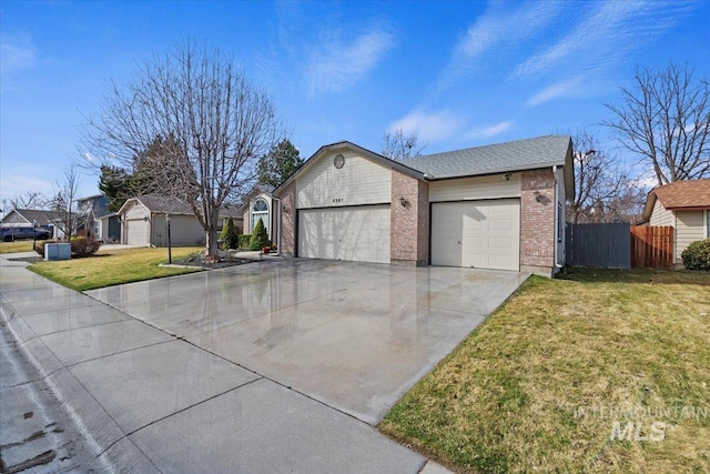 view of front of home featuring fence, an attached garage, a front lawn, concrete driveway, and brick siding