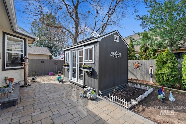 view of shed featuring a fenced backyard