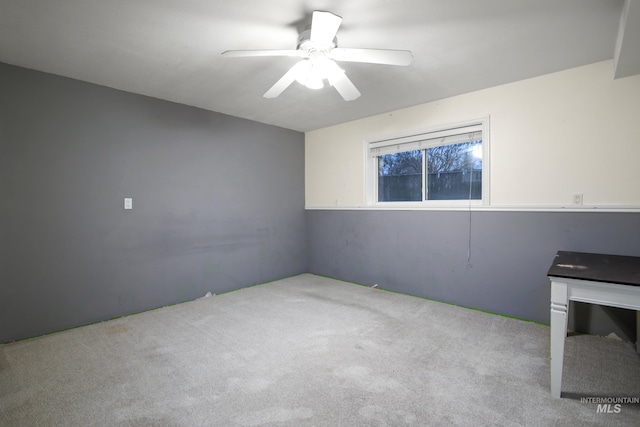 unfurnished room featuring light carpet and ceiling fan