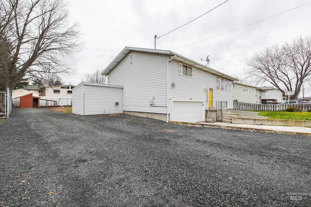 view of side of home with a garage