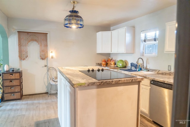 224 S Fern St, Nampa, ID 83686 - kitchen featuring stainless steel dishwasher, black electric stovetop, light wood-style floors, light countertops, and white cabinets