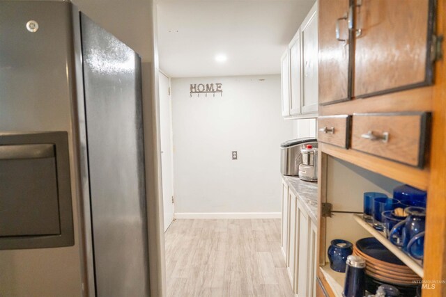 224 S Fern St, Nampa, ID 83686 - hallway with light wood-style floors and baseboards