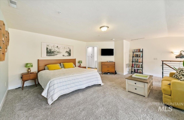 bedroom with visible vents, baseboards, and light carpet