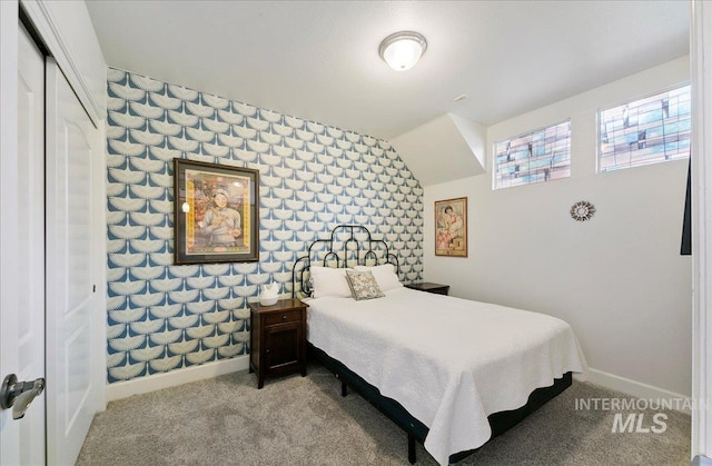bedroom featuring carpet flooring and baseboards
