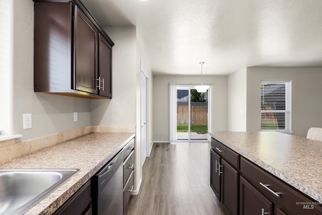 4618 Braeburn Ave, Caldwell, ID 83607 - kitchen featuring dishwasher, dark brown cabinets, wood finished floors, and light countertops