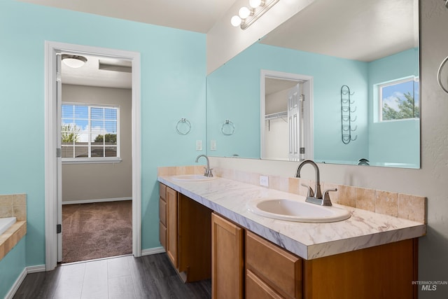 4618 Braeburn Ave, Caldwell, ID 83607 - full bath featuring healthy amount of natural light, double vanity, and a relaxing tiled tub
