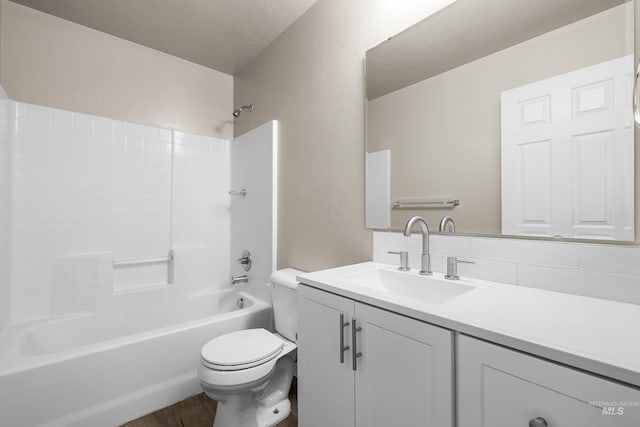 4618 Braeburn Ave, Caldwell, ID 83607 - full bathroom featuring vanity, shower / tub combination, wood finished floors, and a textured wall