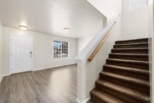 4618 Braeburn Ave, Caldwell, ID 83607 - entryway featuring stairs and wood finished floors