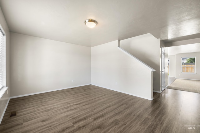 4618 Braeburn Ave, Caldwell, ID 83607 - spare room with dark wood-style floors and baseboards