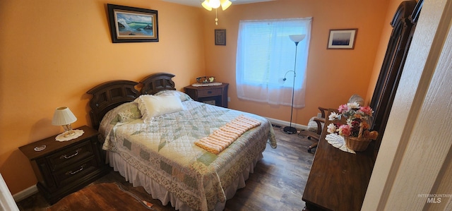 817 6th St, Kamiah, ID 83536 - bedroom with dark wood-style flooring and baseboards