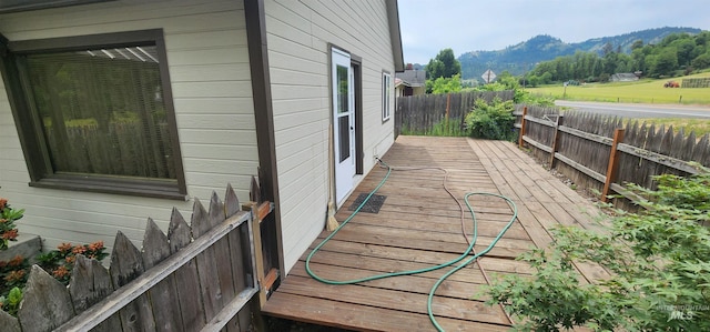817 6th St, Kamiah, ID 83536 - wooden terrace featuring a fenced backyard and a mountain view