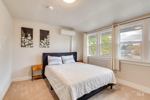 bedroom featuring lofted ceiling, baseboards, a wall mounted AC, and light colored carpet