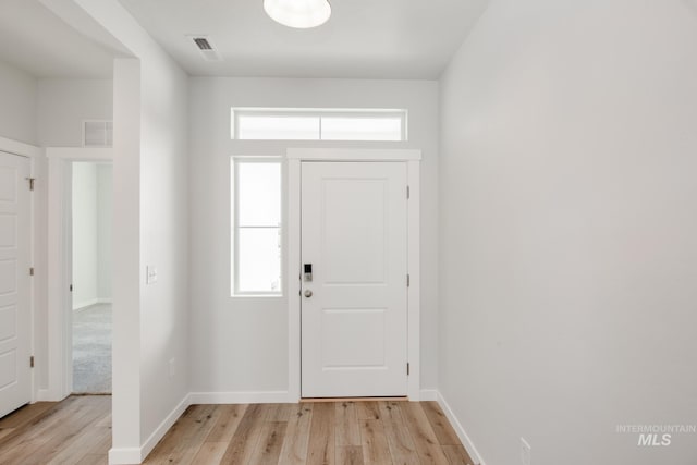 entryway with light hardwood / wood-style floors